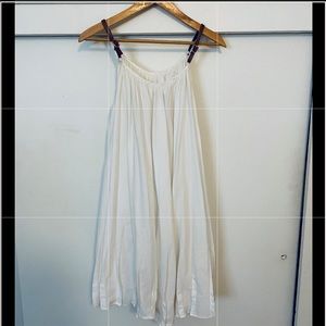 Cotton babydoll dress with vegan leather straps